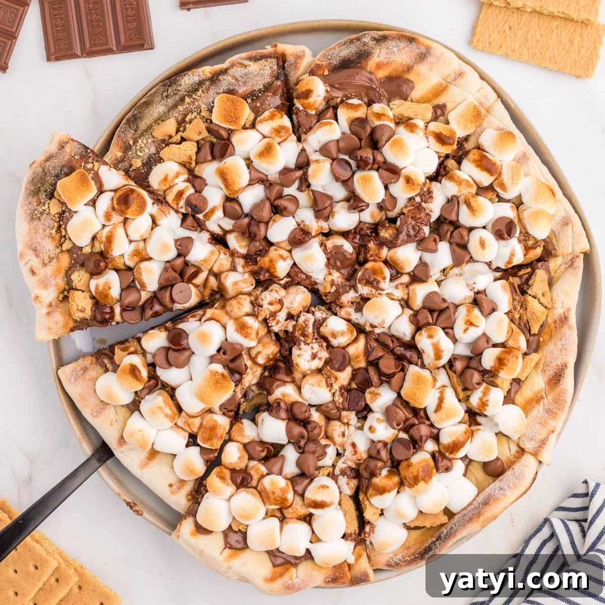 S'mores pizza with chocolate chips and marshmallows.