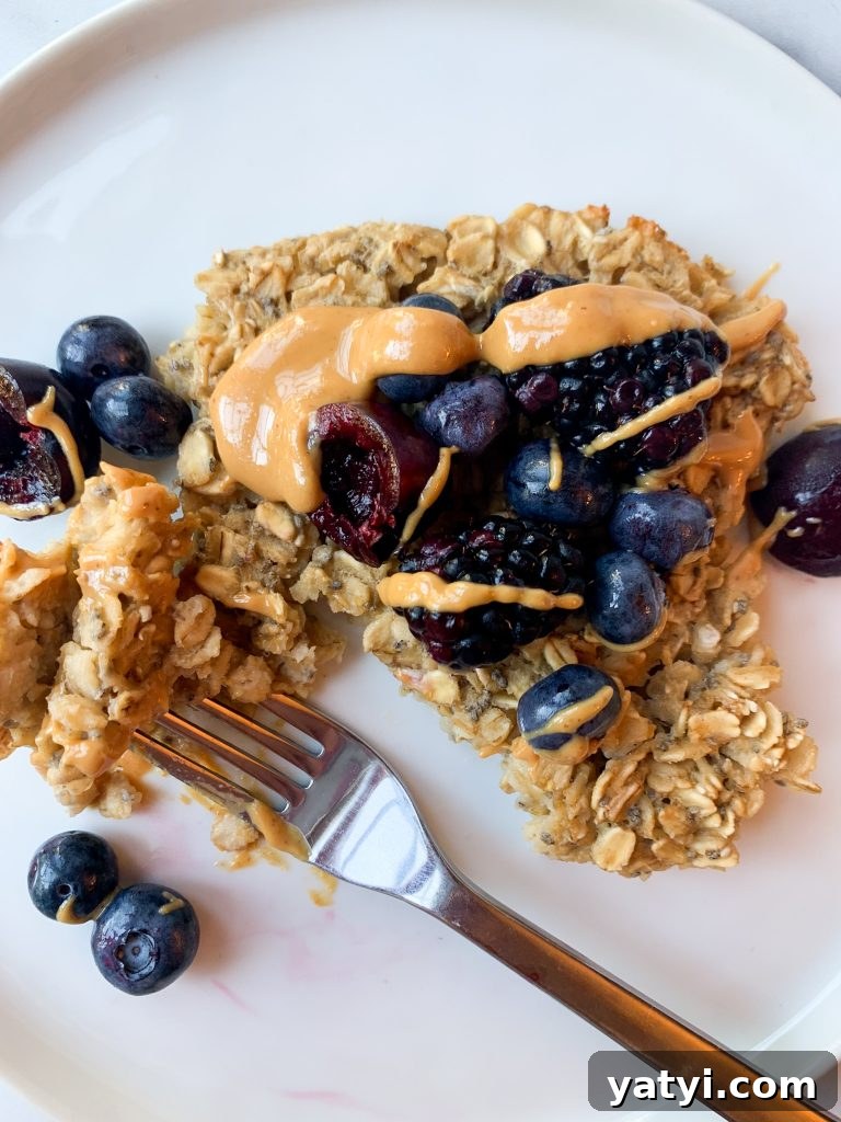 Baked Oatmeal Casserole with Berries and Cinnamon Bowl 3 baked oats topped with peanut butter and fresh fruit