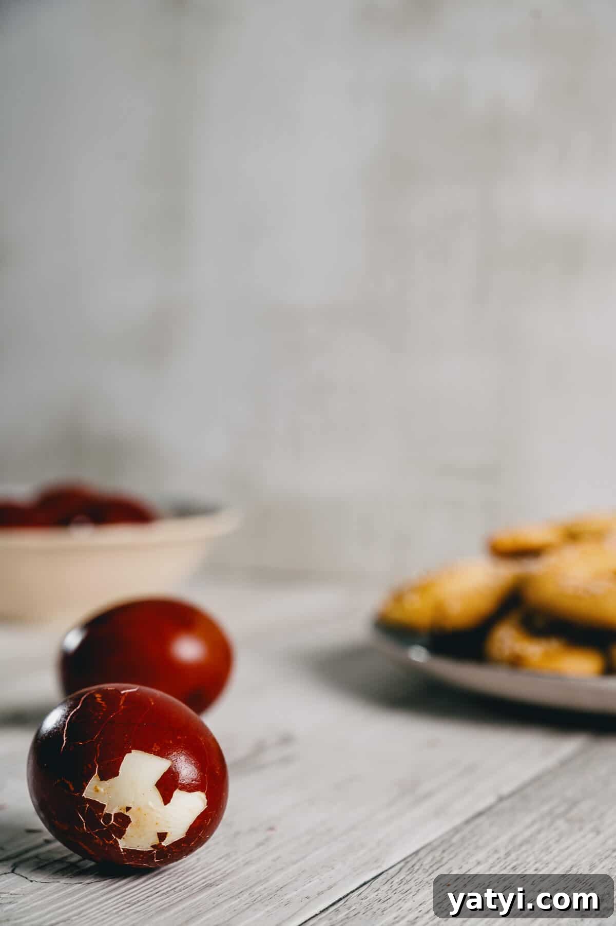 Greek Easter Traditions: Customs, Foods, and Celebrations Explained 15 a cracked red egg on a white table