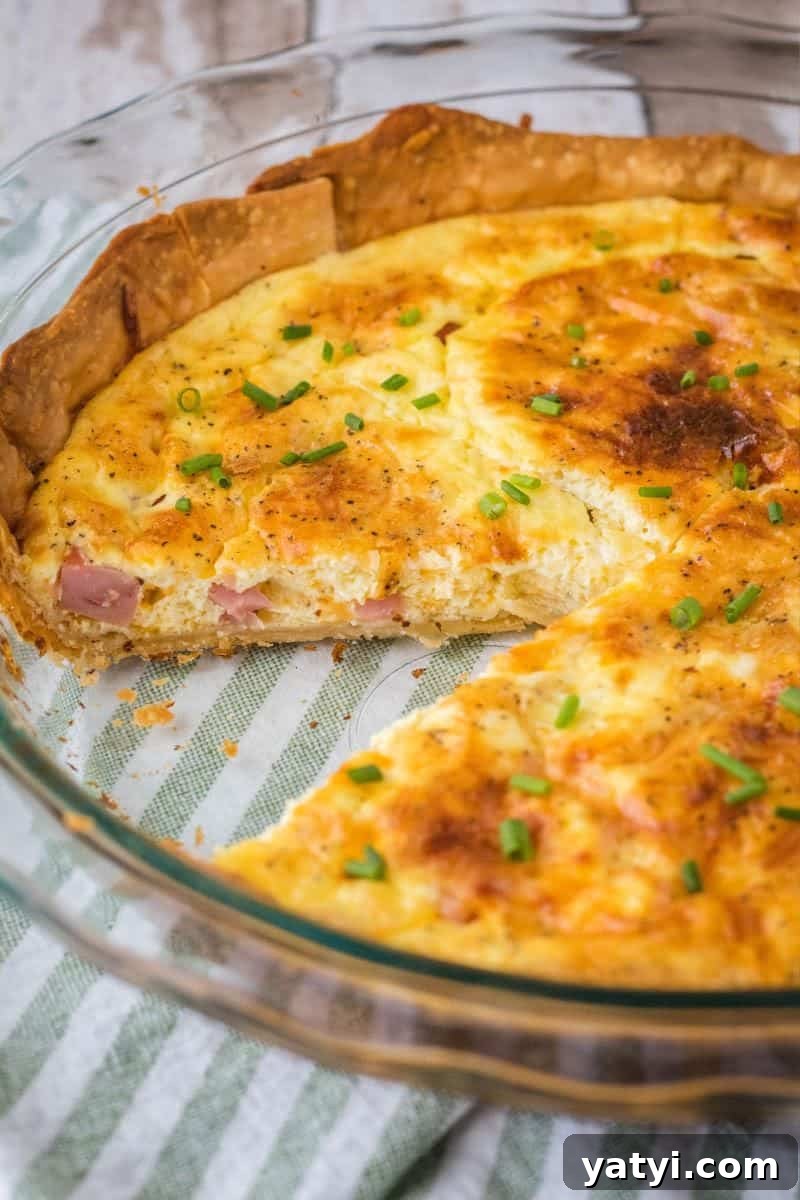 Ham and Cheese Quiche Recipe with Flaky Crust 2 ham cheese quiche with a slice taken out