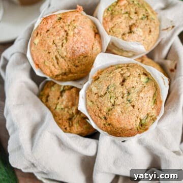 Sourdough Discard Zucchini Muffins Recipe (Quick & Moist) 15 The sourdough discard zucchini muffins are piled high in a bowl.