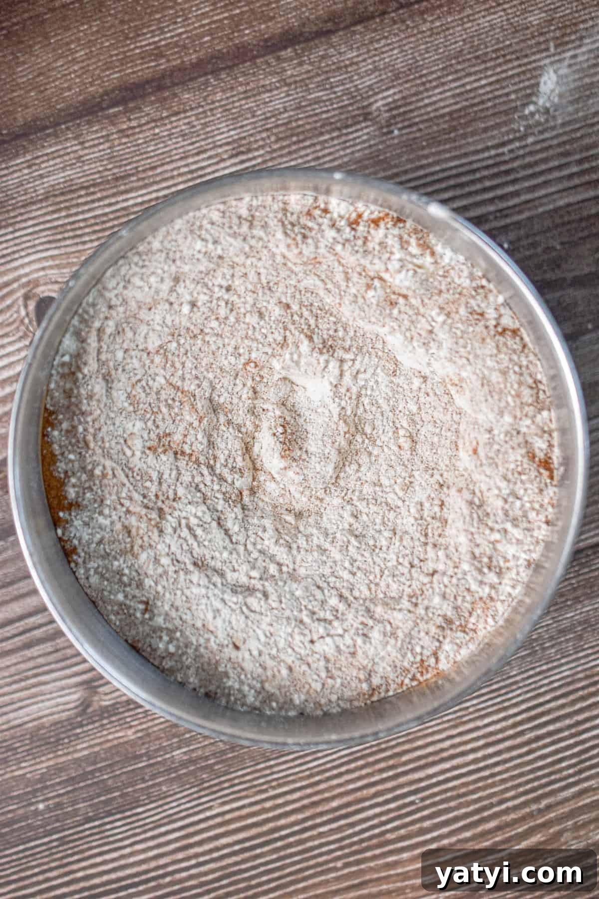 Sourdough Discard Zucchini Muffins Recipe (Quick & Moist) 4 The dry ingredients are mixed together in a small bowl.