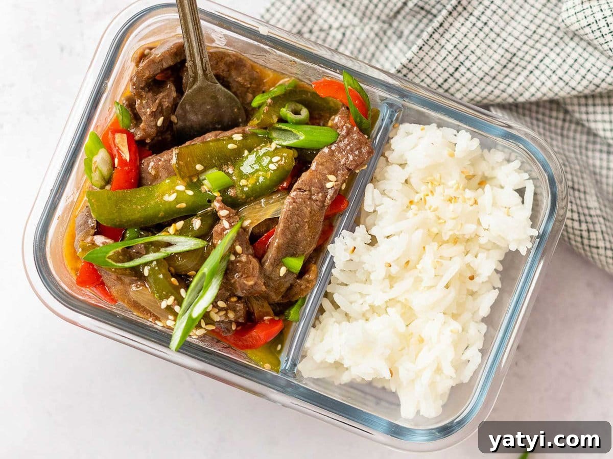Instant Pot Pepper Steak Recipe: Tender Beef with Bell Peppers 3 horizontal image showing a meal prep container filled with pepper steak and white rice