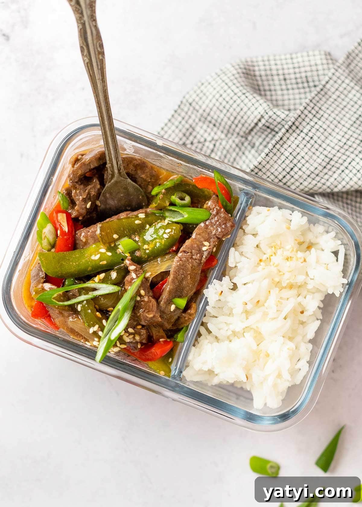 Instant Pot Pepper Steak Recipe: Tender Beef with Bell Peppers 5 pepper steak in meal prep container with rice