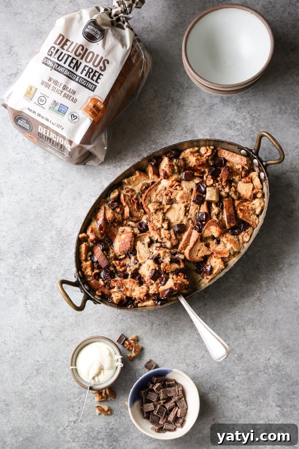 Gluten- and Dairy-Free Chocolate Chip Banana Bread Pudding 5 casserole dish of banana and bread pudding with chocolate chips and bowls on the side