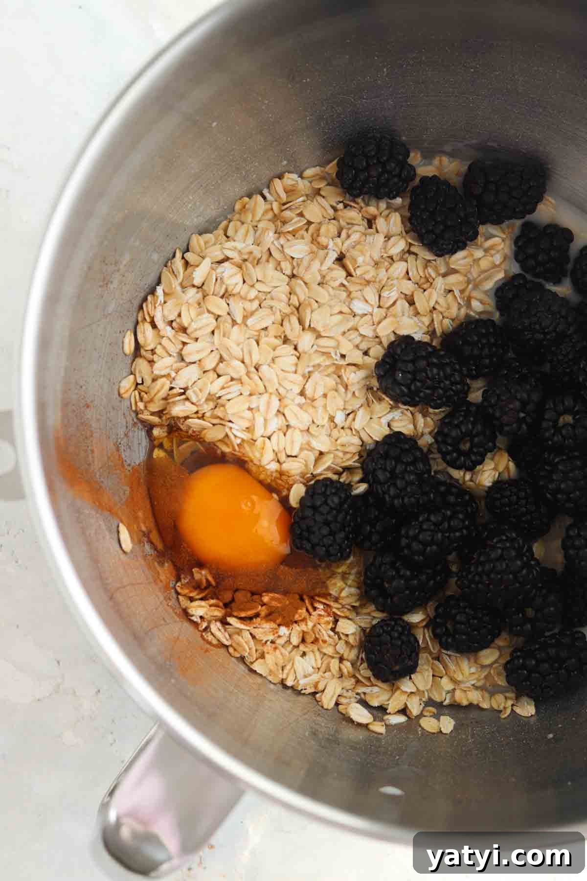 Blackberry Baked Oatmeal Recipe for Summer Brunch 4 Blackberry oatmeal ingredients in a stainless bowl.