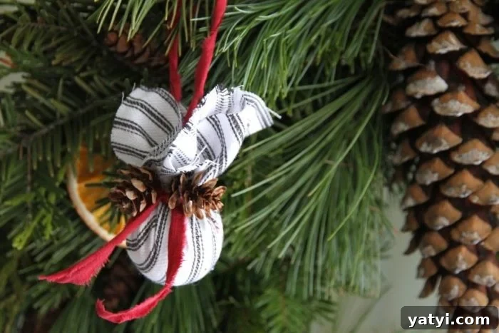 DIY Farmhouse Fabric Ornament Balls: Step-by-Step Guide 3 Cloth covered Christmas tree ornament hanging from the tree