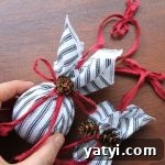 DIY Farmhouse Fabric Ornament Balls: Step-by-Step Guide 4 Farmhouse Christmas tree ornaments covered with ticking fabric and tied with a red bow