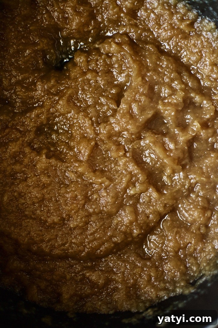 How to Make Rich Homemade Apple Butter in Your Kitchen 6 Softened apples pureed into apple sauce at this point.