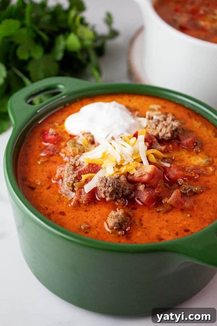 Hearty Keto Ground Beef Stew Recipe for Low-Carb Meals 12 bowl of keto taco soup topped with sour cream and cheese