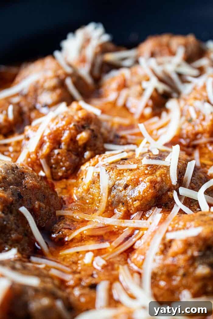 Hearty Keto Ground Beef Stew Recipe for Low-Carb Meals 8 sideview of keto meatballs in marinara sauce topped with parmesan