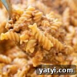 spoon with ground beef pasta
