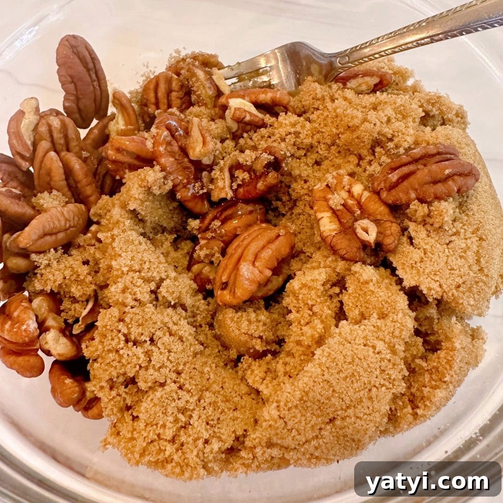 Decadent Chocolate Pecan Chess Pie Recipe for Home Bakers 10 Pecans and brown sugar mixture in a bowl for crispy pecan topping.