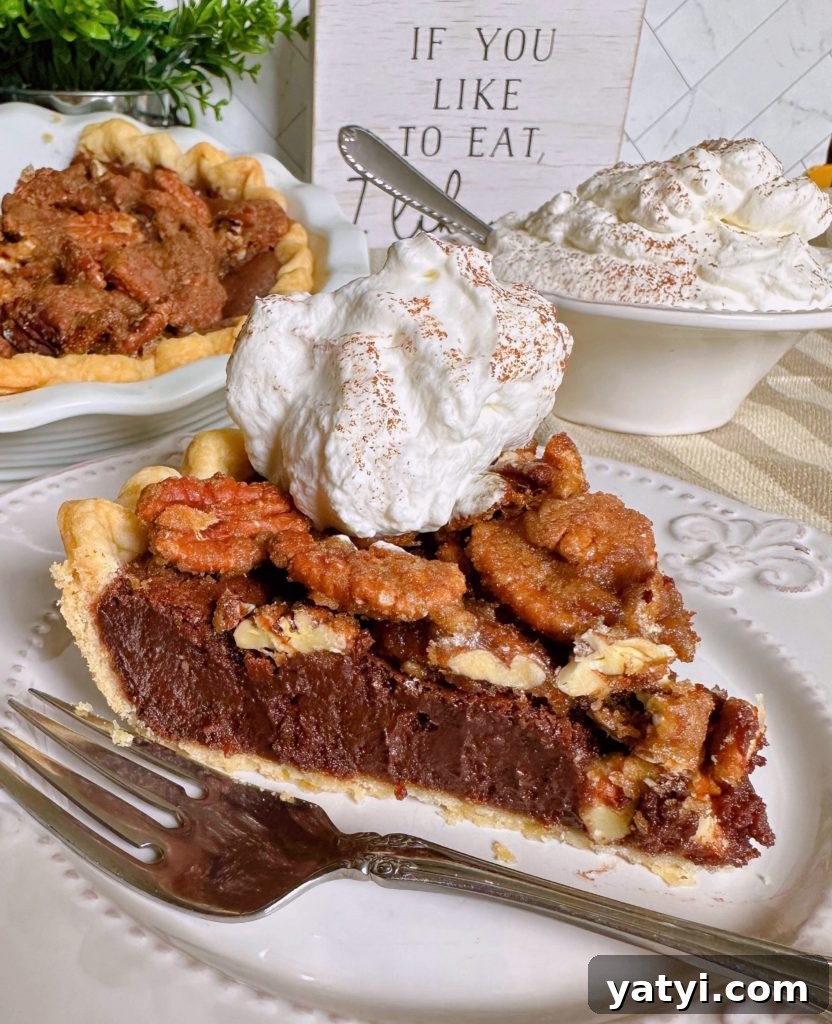 Decadent Chocolate Pecan Chess Pie Recipe for Home Bakers 13 Easy Chocolate Pecan Chess Pie sliced and on a plate with a dollop of whipped cream.