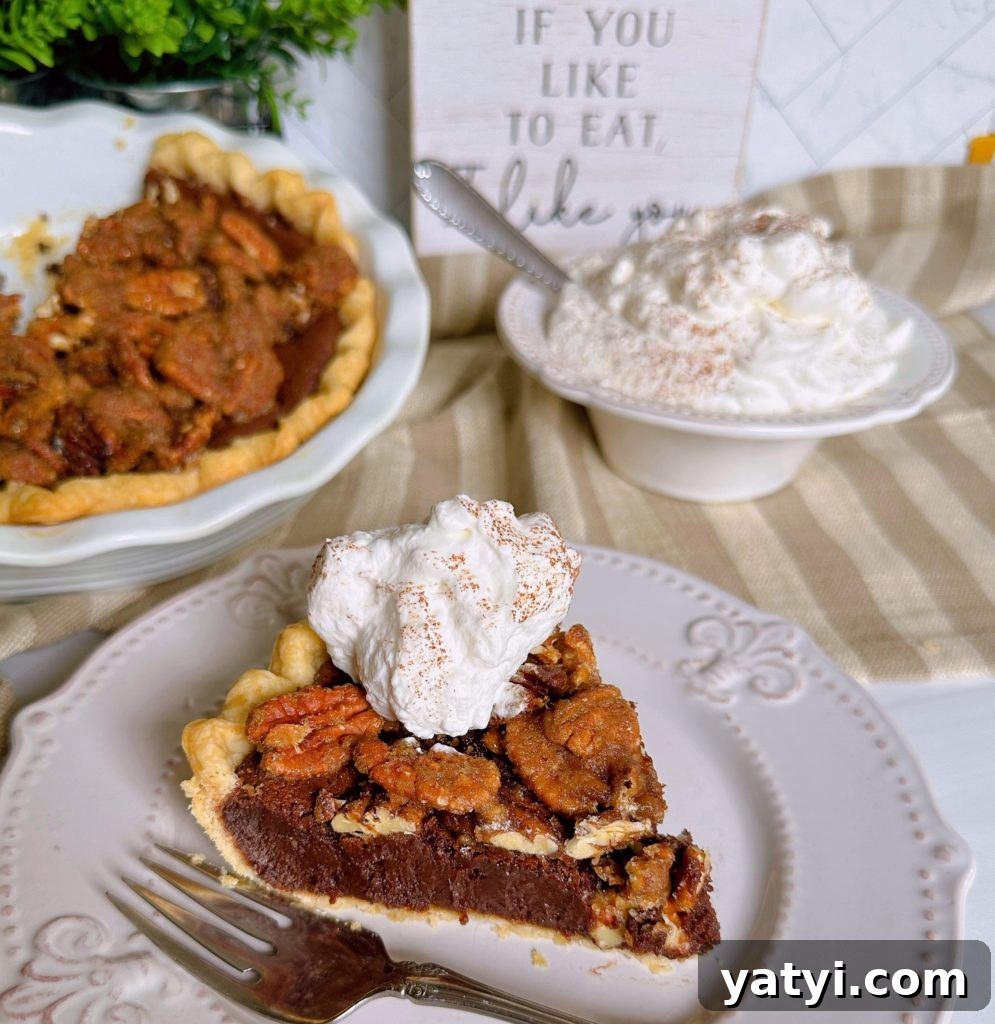 Decadent Chocolate Pecan Chess Pie Recipe for Home Bakers 3 Chocolate Pecan Chess Pie sliced on a white plate with a big dollop of whipped cream and the whole pie in the background.