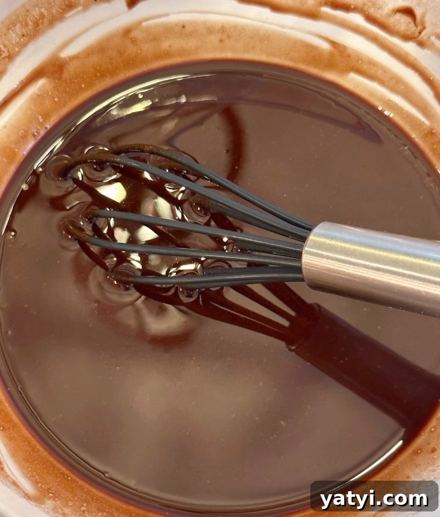 Decadent Chocolate Pecan Chess Pie Recipe for Home Bakers 7 Stirring melted chocolate and butter until smooth.