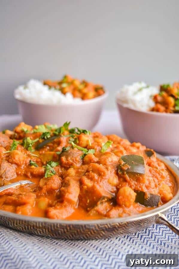 One-Pot Vegan Tikka Masala Recipe for Flavorful Dinner 4 Three bowls of orange curry on a blue and white background, two with rice on the side