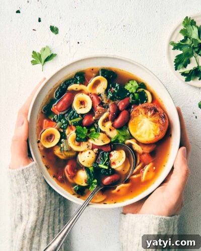 Veggie bean soup topped with roasted lemon topped with parsley
