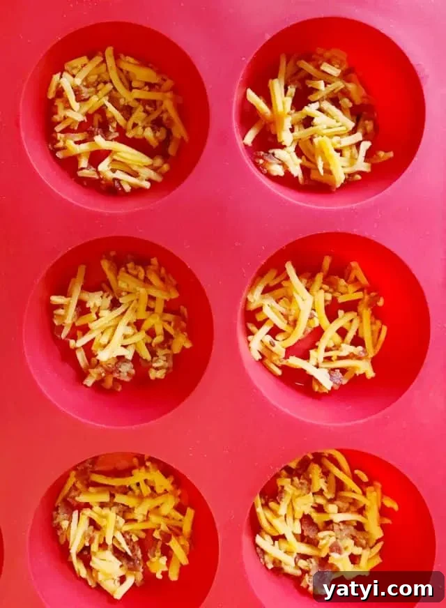 Keto Bacon & Cheddar Crisps — Low-Carb Snack Recipe 8 sprinkle in a silicone muffin pan