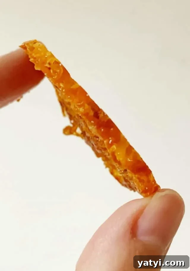 Keto Bacon & Cheddar Crisps — Low-Carb Snack Recipe 11 side view of bacon cheddar crisps