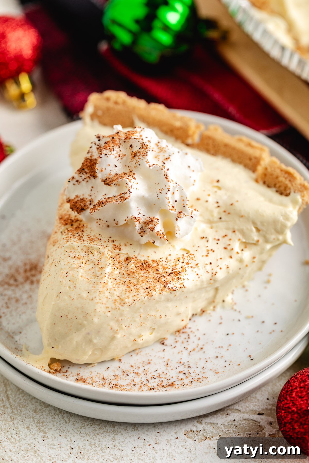 Creamy eggnog pie on a plate.