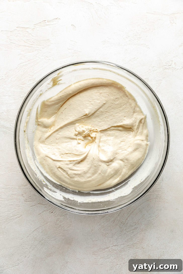 Creamy mixture in glass bowl.