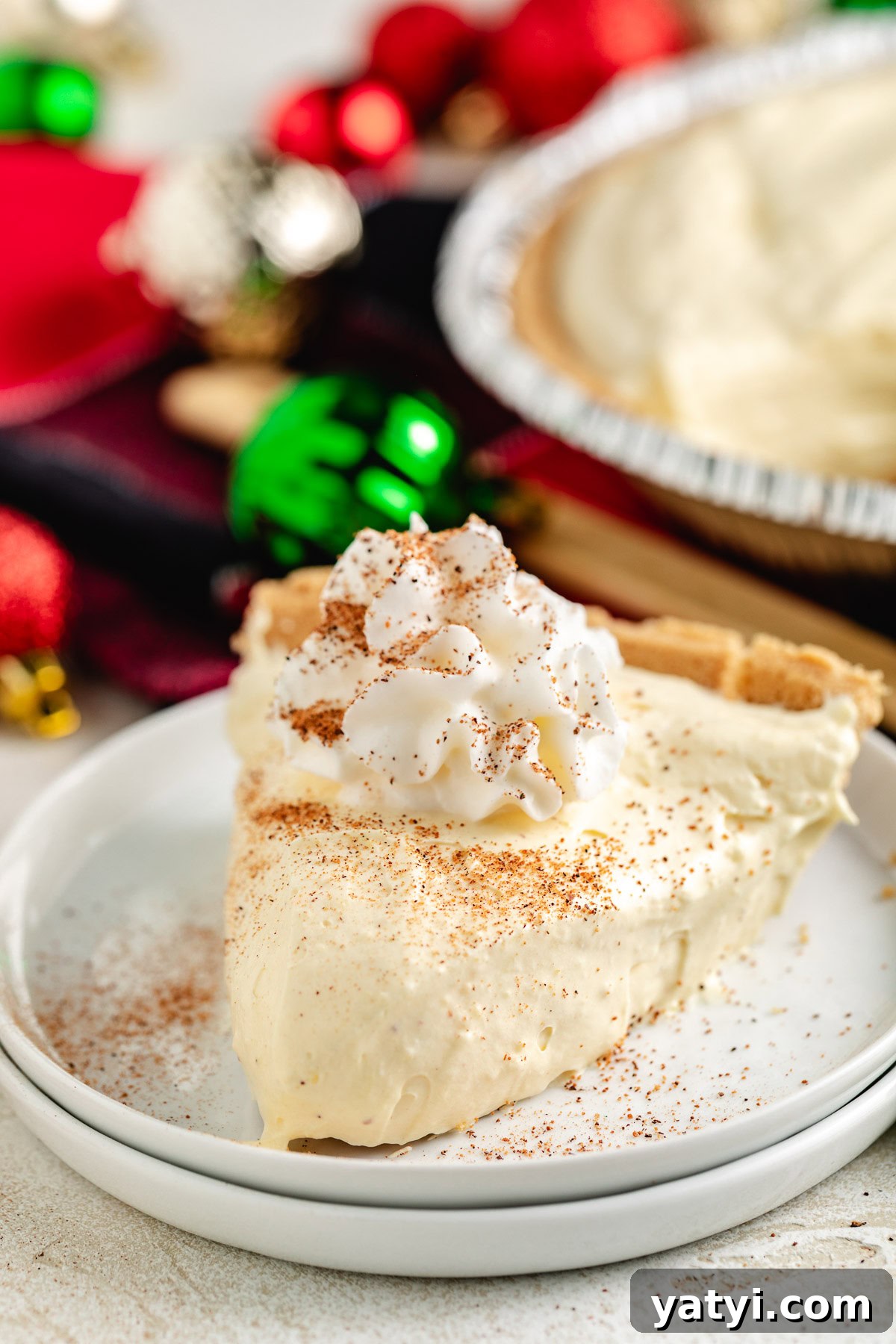 Creamy eggnog pie with whipped topping.