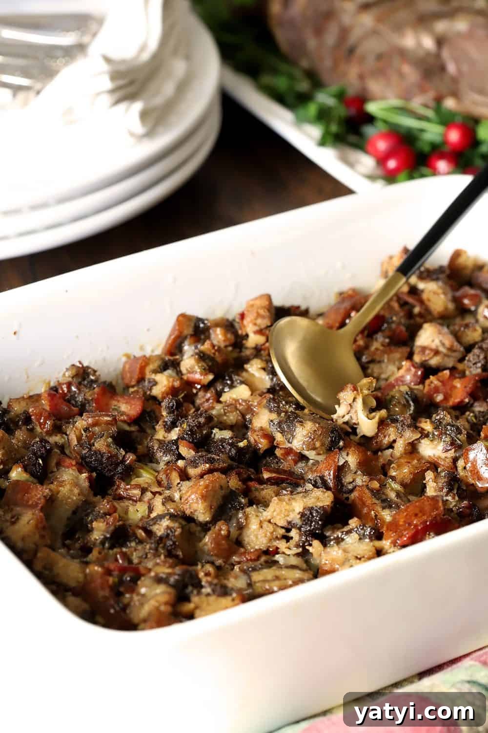 Bourbon-Infused Pumpernickel & Rye Stuffing Recipe 3 Rye and Pumpernickel Dressing with Bourbon and Bacon in a White Serving Dish.