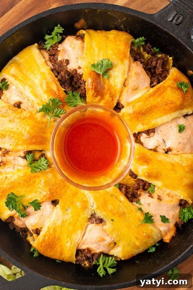This delicious Taco Bell Gordita Ring with a crescent twist! It's loaded with layers of seasoned meat, crispy taco shell pieces, and cheese.