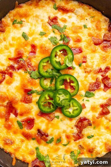 Jalapeño Popper Dip is the best hot cheese dip ever! This tasty Appetizer is perfect for parties, game days, or tailgating.
