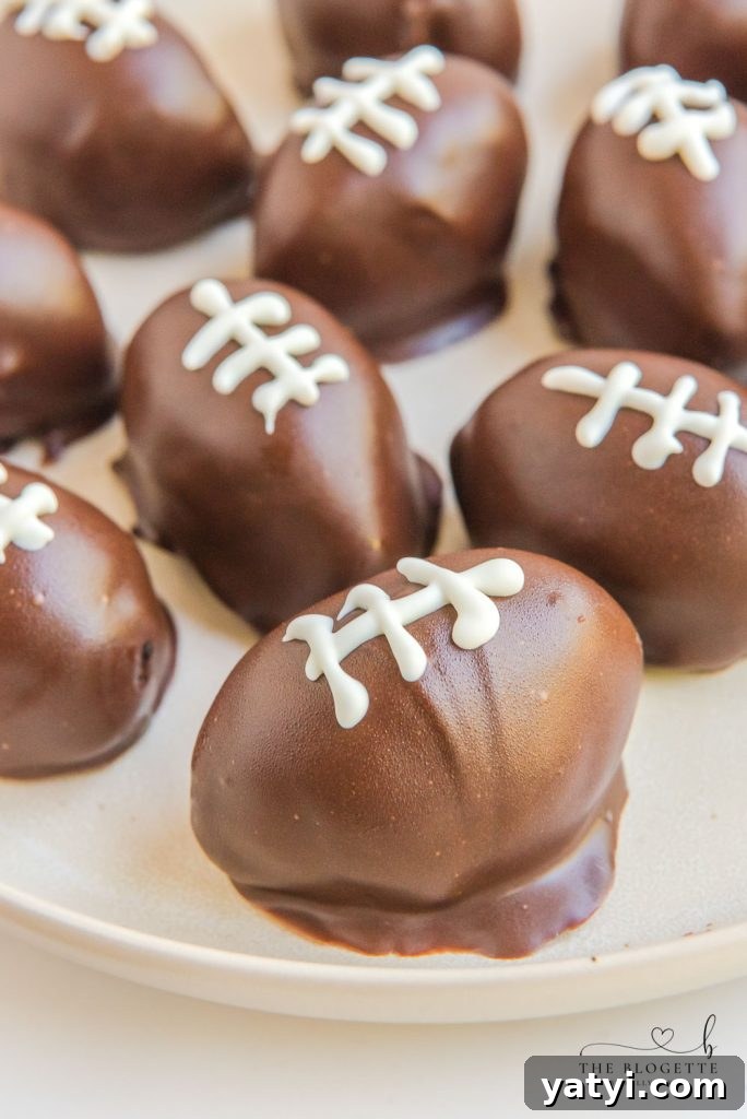 Oreo Football Truffles are perfect for the Super Bowl, Tailgating Parties, or even just to snack on during the game! Only 5 ingredients!
