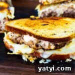 Turkey Reuben Patty Melt Recipe — Tangy Thousand Island Turkey Burgers 5 Turkey Burger Reuben Patty Melts on a cutting board.