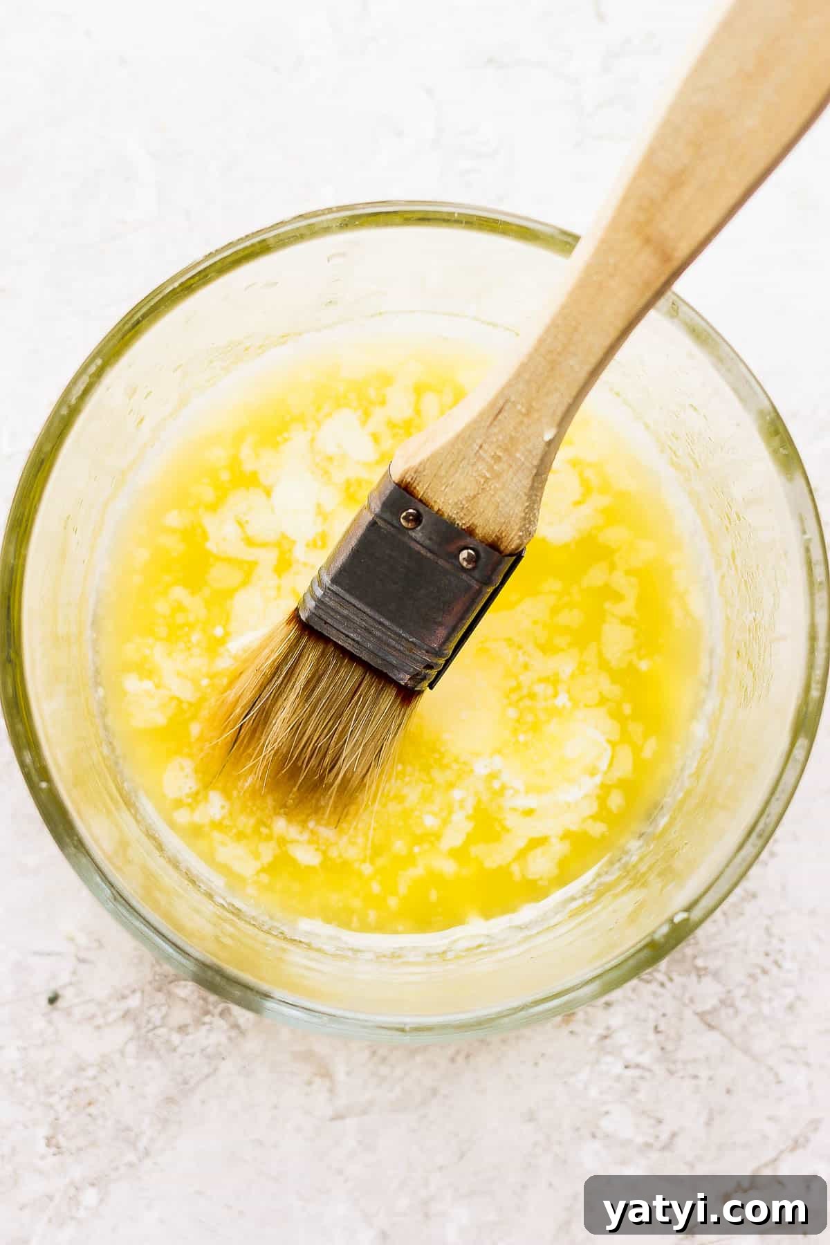 Ultimate Smoked Corn on the Cob Recipe for Sweet, Smoky Flavor 6 Bowl of melted butter with brush for basting smoked corn.