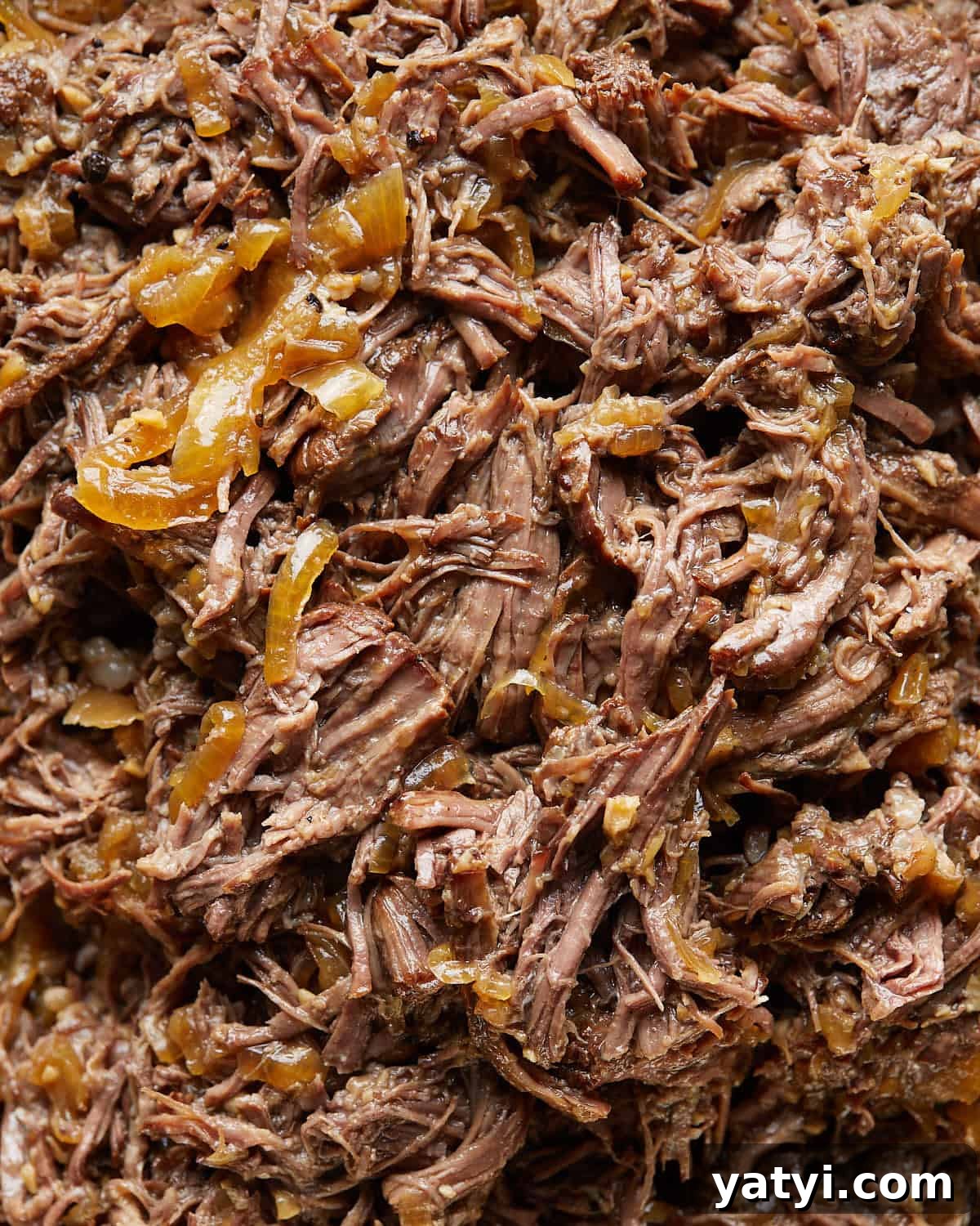 Fall-Apart Oven Chuck Roast Recipe for Tender, Juicy Beef 2 Up close overhead image of chuck roast in oven recipe.