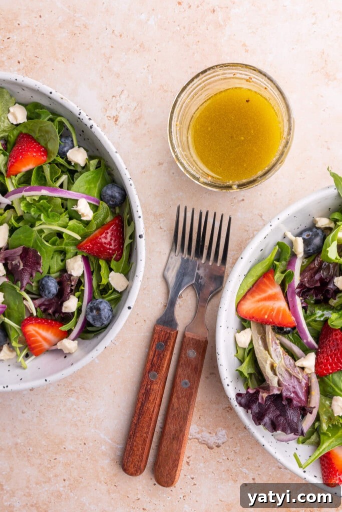 Maple Dijon Vinaigrette with 4 Simple Ingredients 2 Overhead shot of two salads and a glass jar of Maple Dijon Vinaigrette