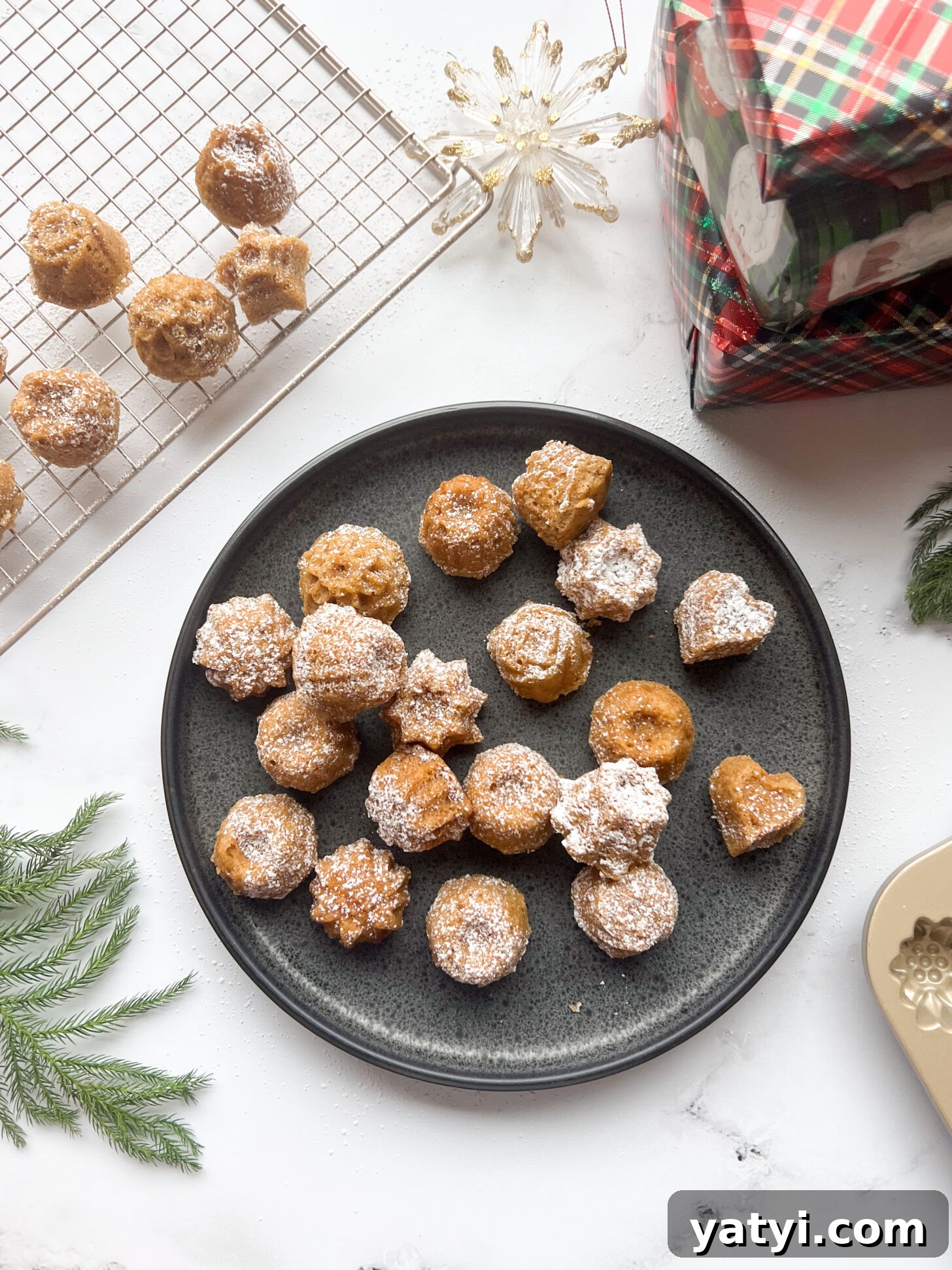 Holiday Cardamom Tea Cakes—Festive Spiced Cake Recipe (Video) 2 Cardamom tea cakes dusted with powdered sugar