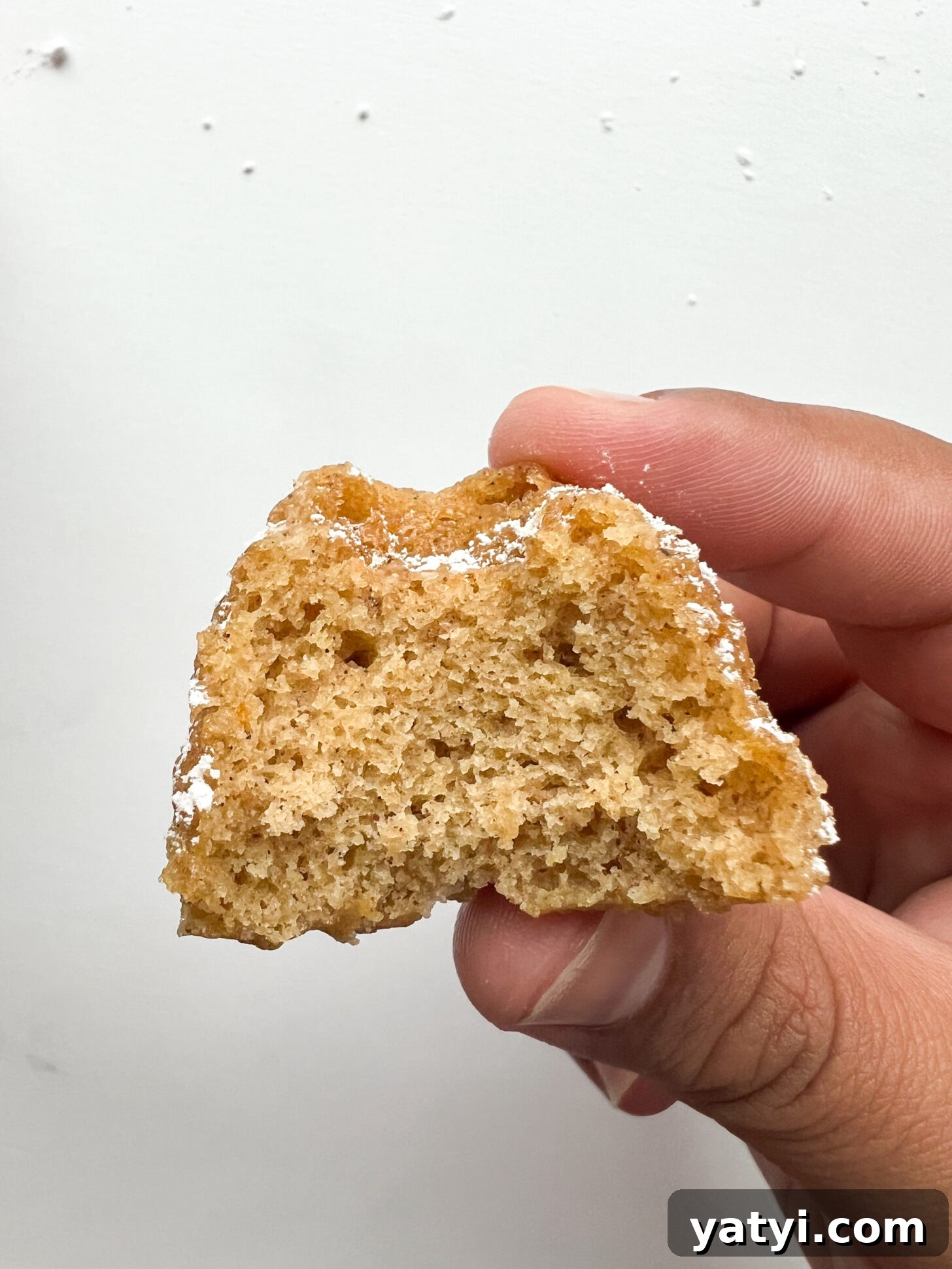 Holiday Cardamom Tea Cakes—Festive Spiced Cake Recipe (Video) 3 Cardamom tea cake with a bite taken out