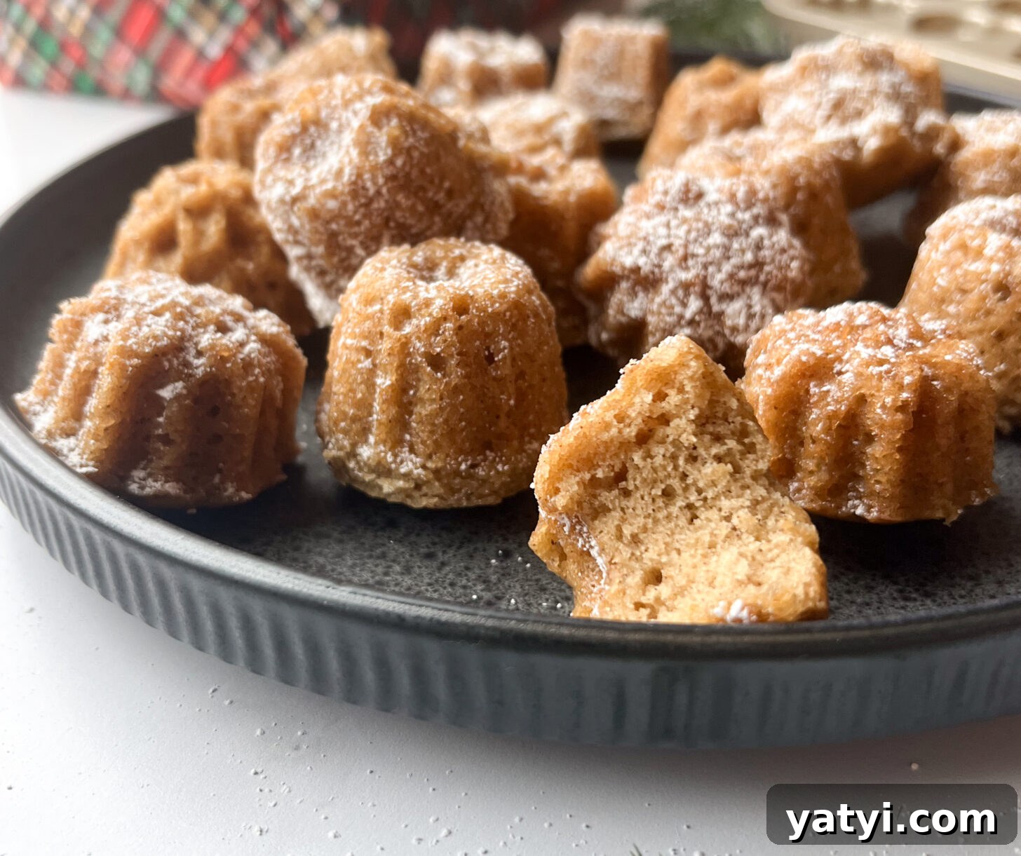 Holiday Cardamom Tea Cakes—Festive Spiced Cake Recipe (Video) 4 Cardamom tea cakes dusted with powdered sugar from the side