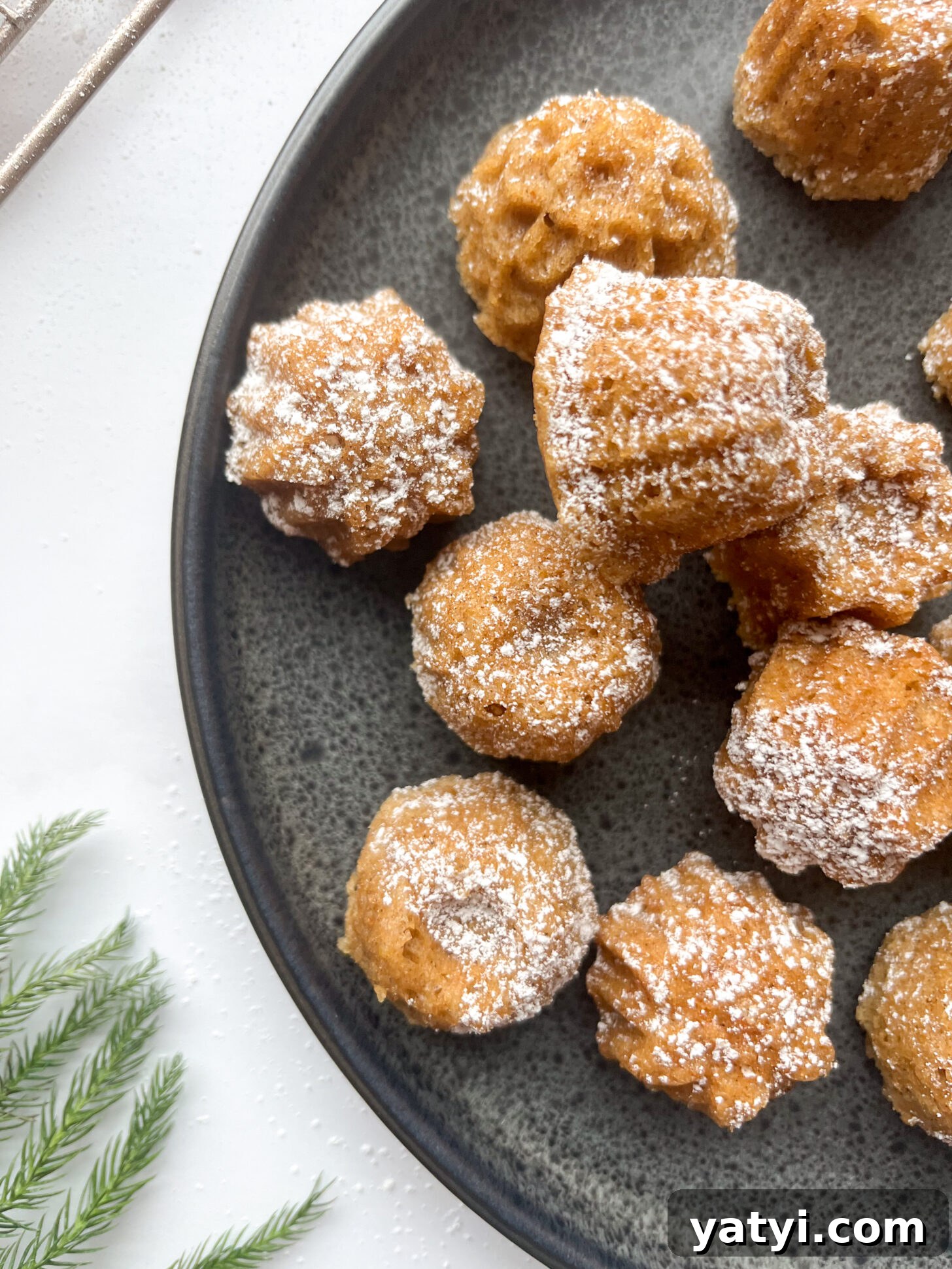 Holiday Cardamom Tea Cakes—Festive Spiced Cake Recipe (Video) 6 Cardamom tea cakes dusted with powdered sugar, close up