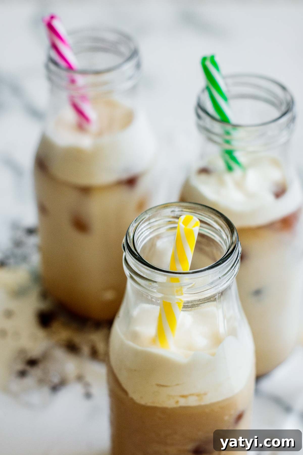 Brown Sugar Milk Tea Recipe Without Tapioca Pearls 2 3 glasses of brown sugar milk tea with frothed cream and reusable straws