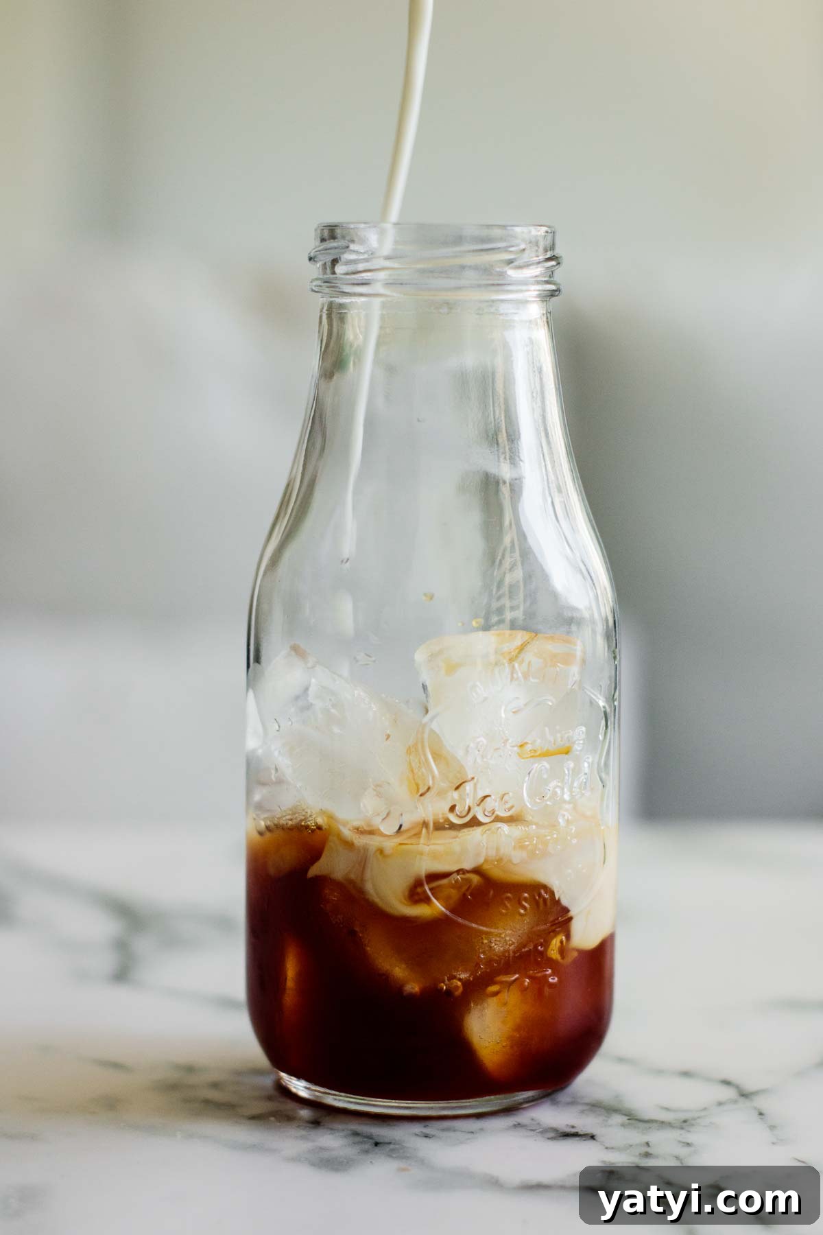 Brown Sugar Milk Tea Recipe Without Tapioca Pearls 3 milk pouring over black tea in transparent glass