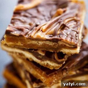 Saltine Cracker Toffee (Christmas Crack): Sweet & Salty Holiday Treat 11 Peanut-Butter-Swirl-Saltine-Crack pieces stacked on each other