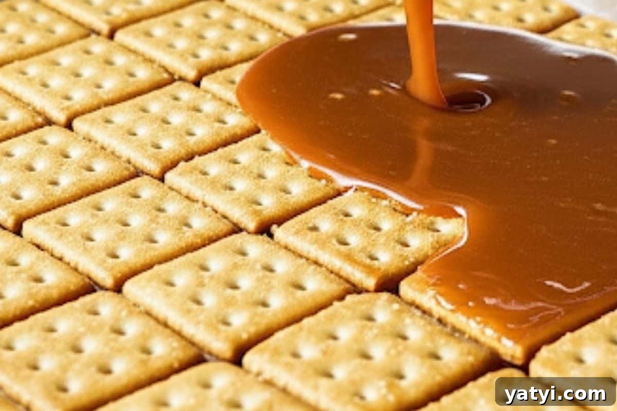 Saltine Cracker Toffee (Christmas Crack): Sweet & Salty Holiday Treat 7 Pour in the hot toffee mixture on top of the crackers.