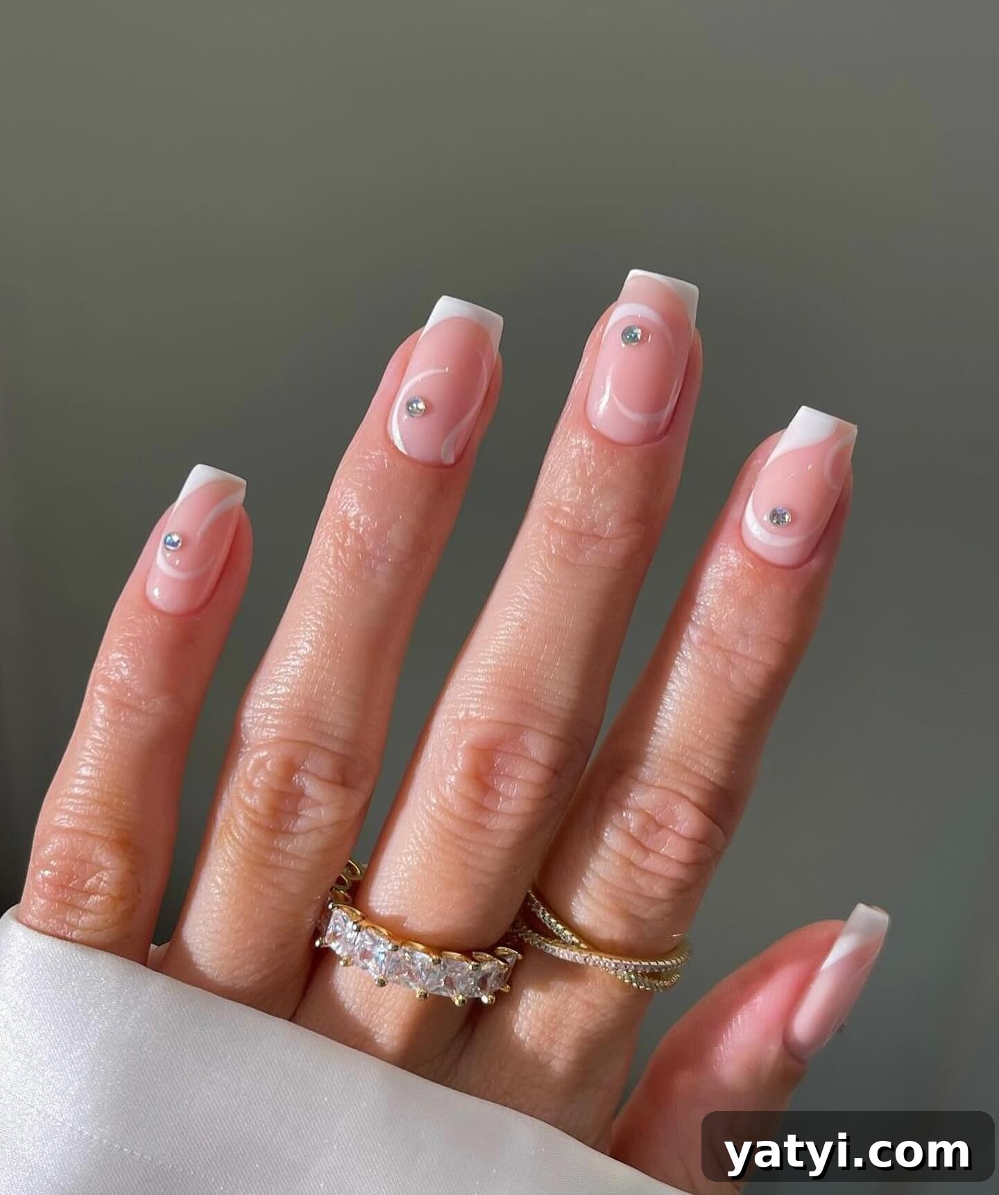 41 Chic Nude Nail Ideas You Can Create at Home 41 39. Swirly Nude Design with Diamonds