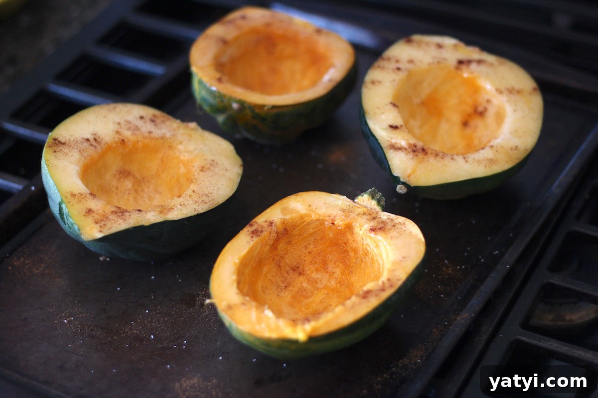 Paleo Moroccan Lamb Stuffed Squash (AIP) - this flavorful meal combines roasted acorn squash with savory lamb, sweet apricots, fresh mint, and tangy pomegranate seeds! Healthy and delicious! | fedandfulfilled.com