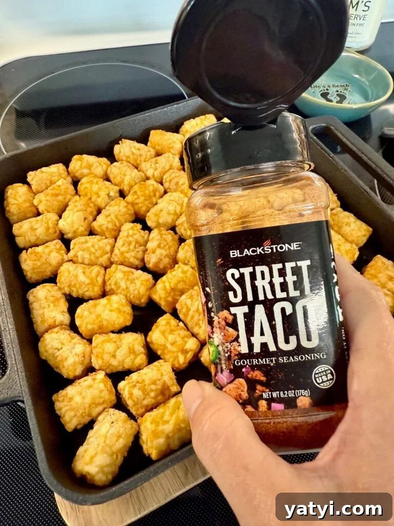 Loaded Taco Tater Tots Made in a Blackstone Pizza Oven 6 seasoning the taco tots