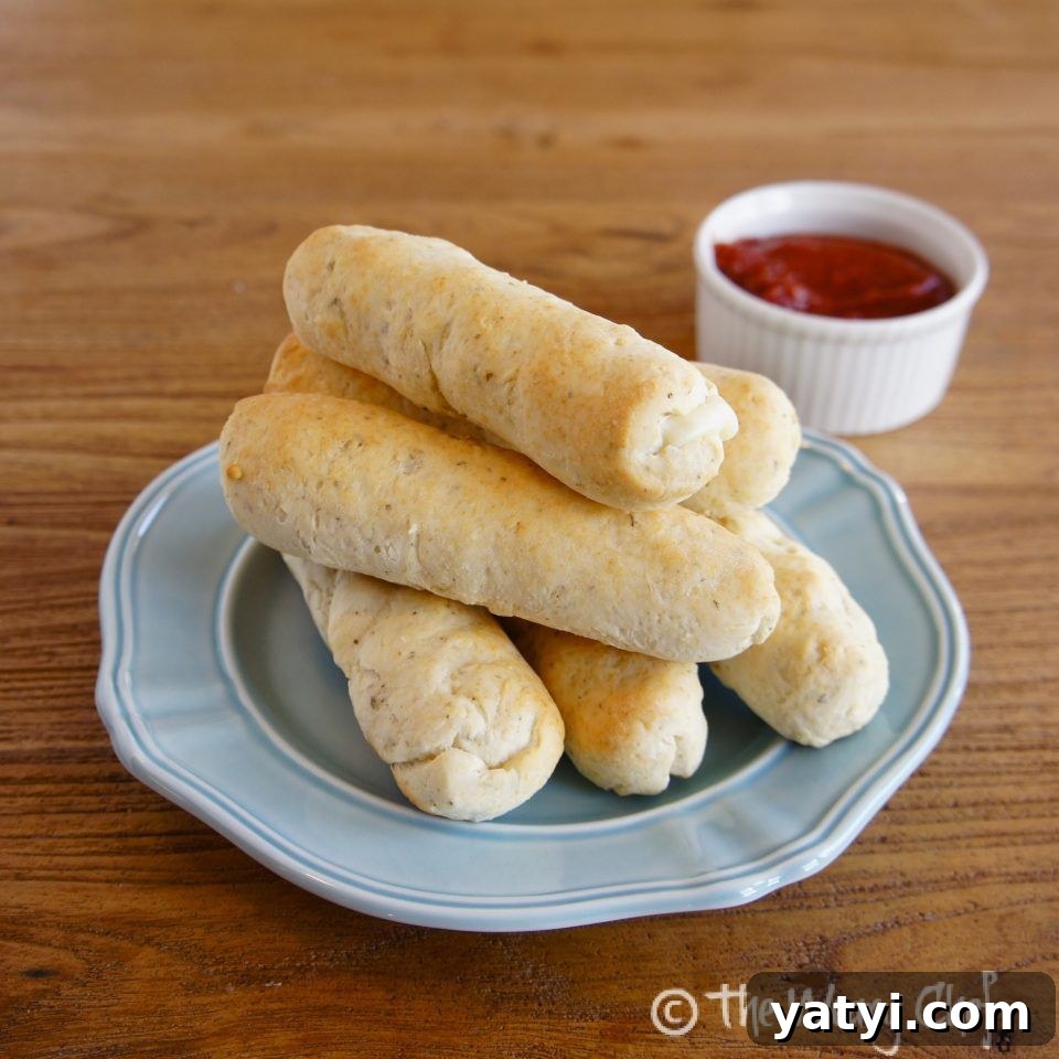 Cheese Stuffed Breadsticks - These breadsticks made with #bisquick and #cheese sticks are fun and easy to make! img 3637 2