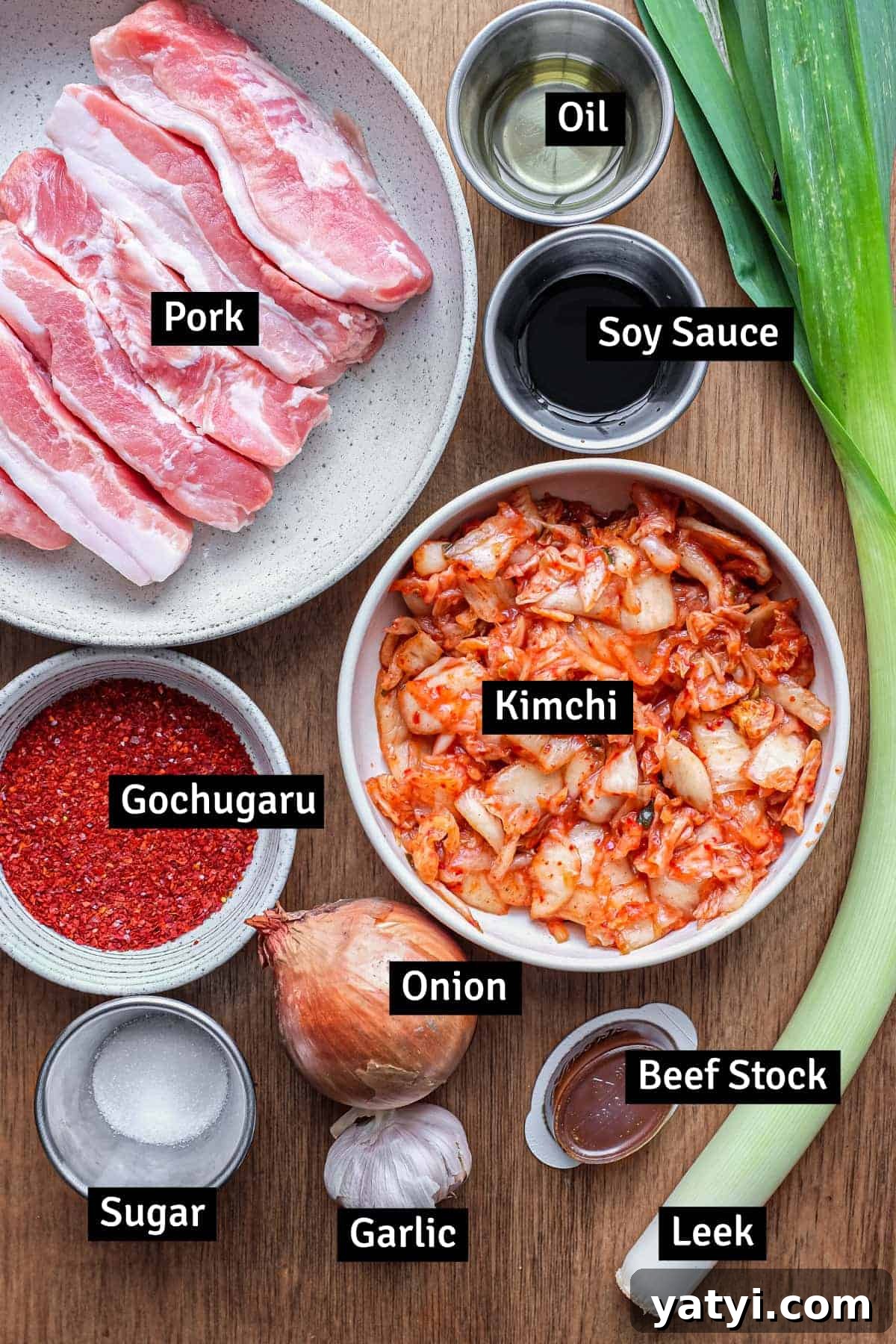 Kimchi Pork Stew | cookeatworld.com The ingredients for Korean kimchi pork stew: kimchi, pork belly, gochugaru chilli flakes, leek and more.