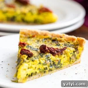 Vegan Mushroom, Spinach & Leek Quiche Recipe 2 a slice of vegan quiche with spinach and leeks