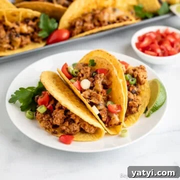 Baked Ground Turkey Tacos on a white plate.